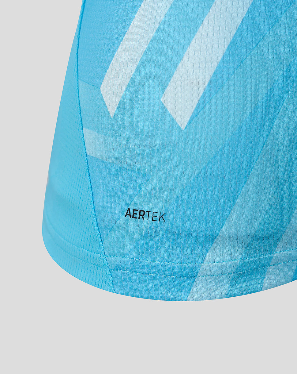 Close-up of light blue athletic shirt fabric with diagonal white stripes and AERTEK branding.