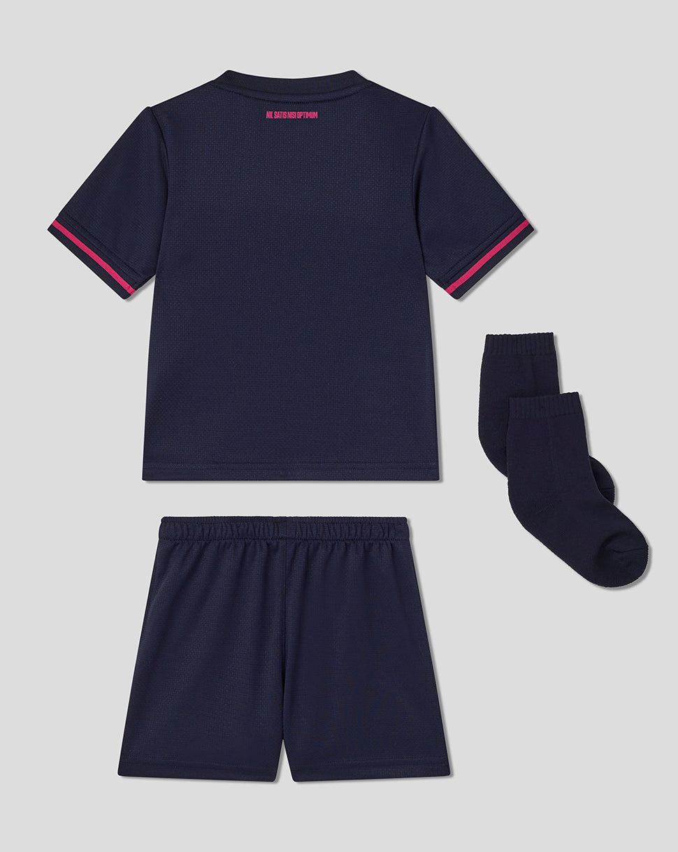 Navy blue sports outfit with shorts and socks on a light gray background