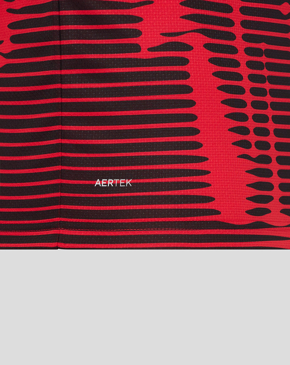 Close-up of red and black striped fabric from the Athletic Club fourth shirt with an AERTEK label.