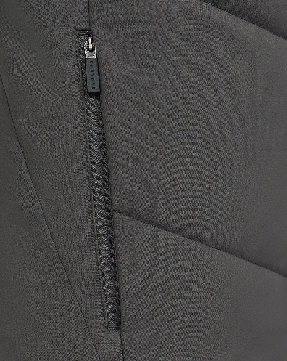 Close up of a vertical zipper pocket on the gray Castore Feyenoord training jacket with panel stitching.