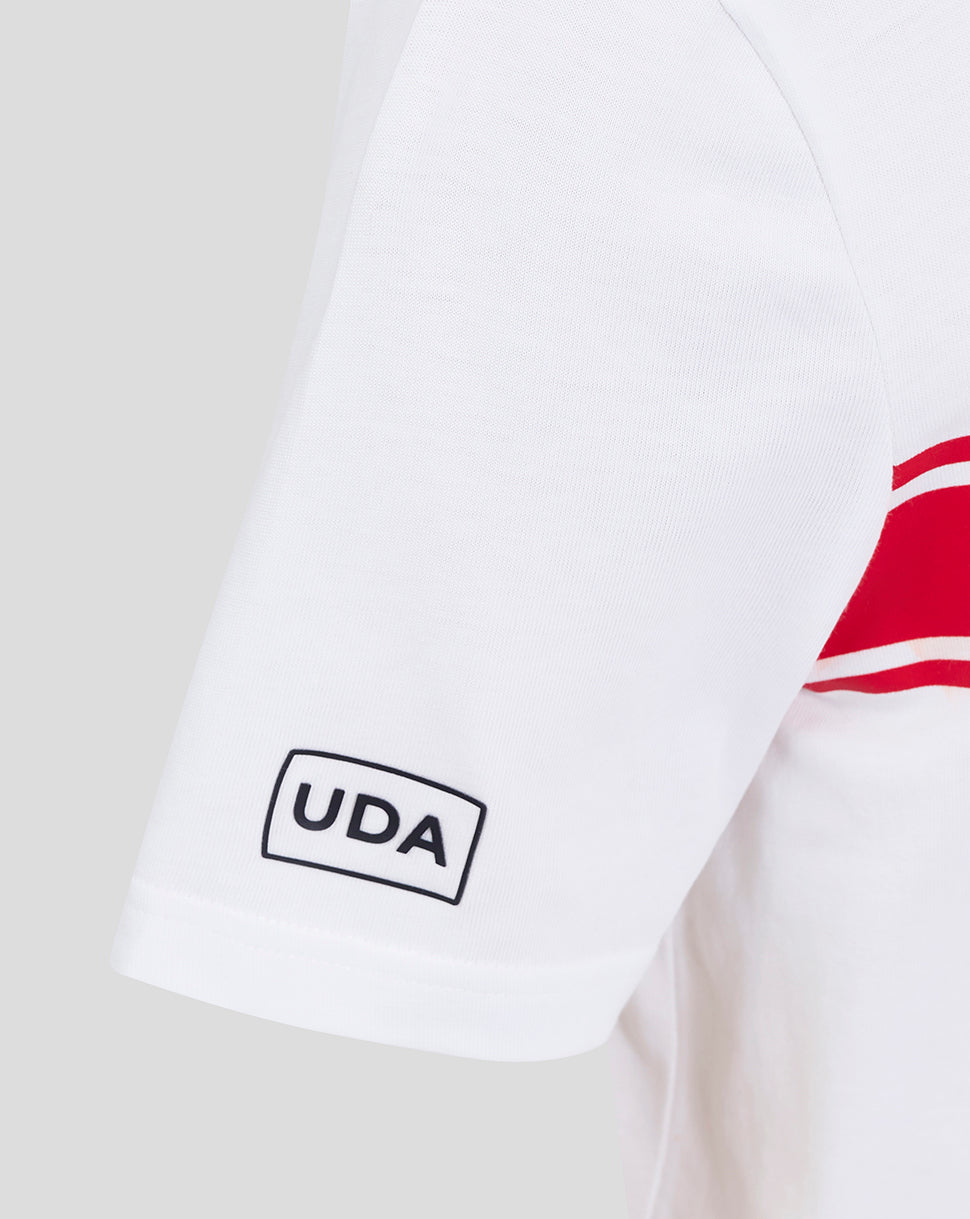 Close up of the white Almeria shirt sleeve showing the UDA patch and red stripe graphic.