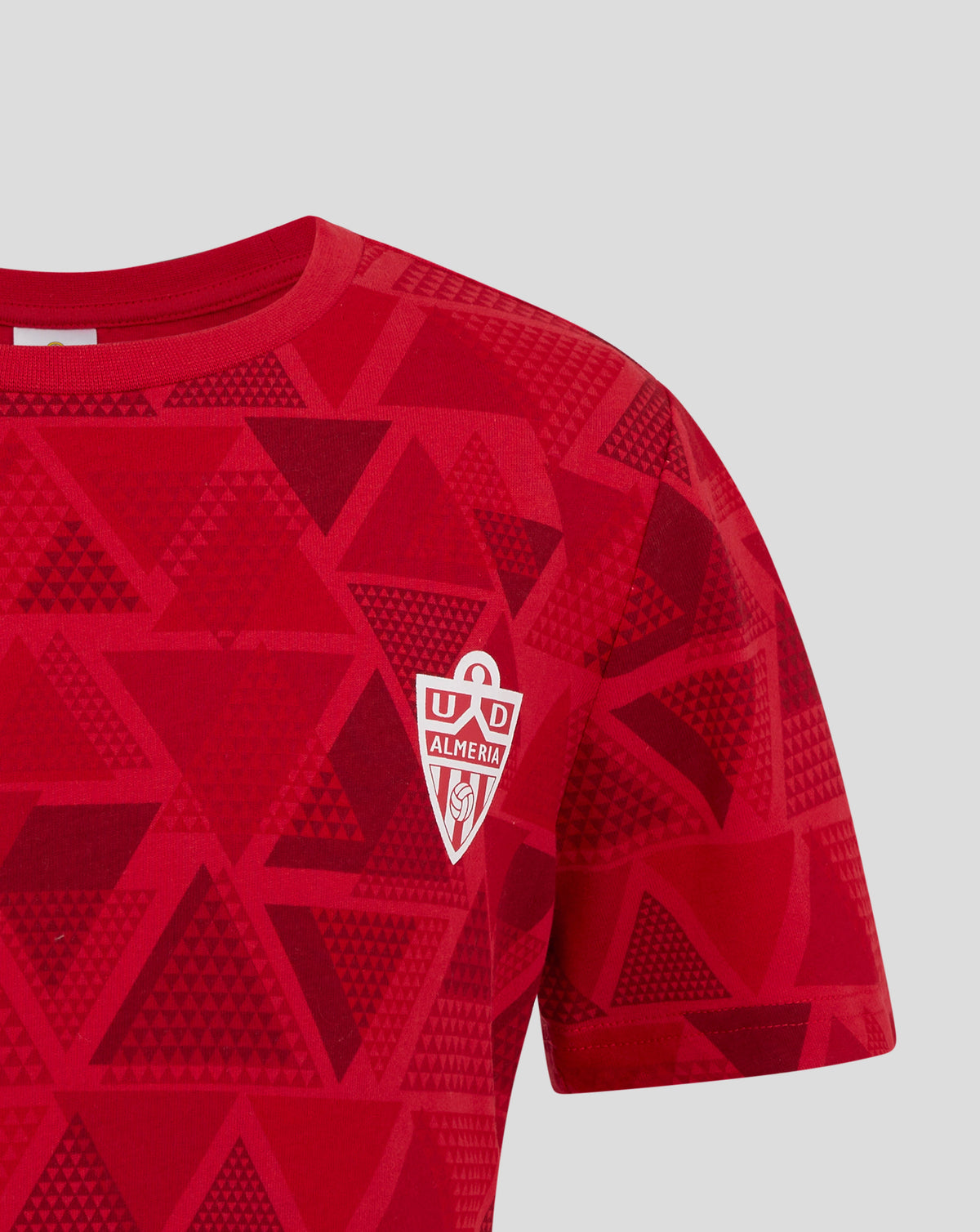 Red geometric patterned junior pajama top with Almeria crest on the chest.