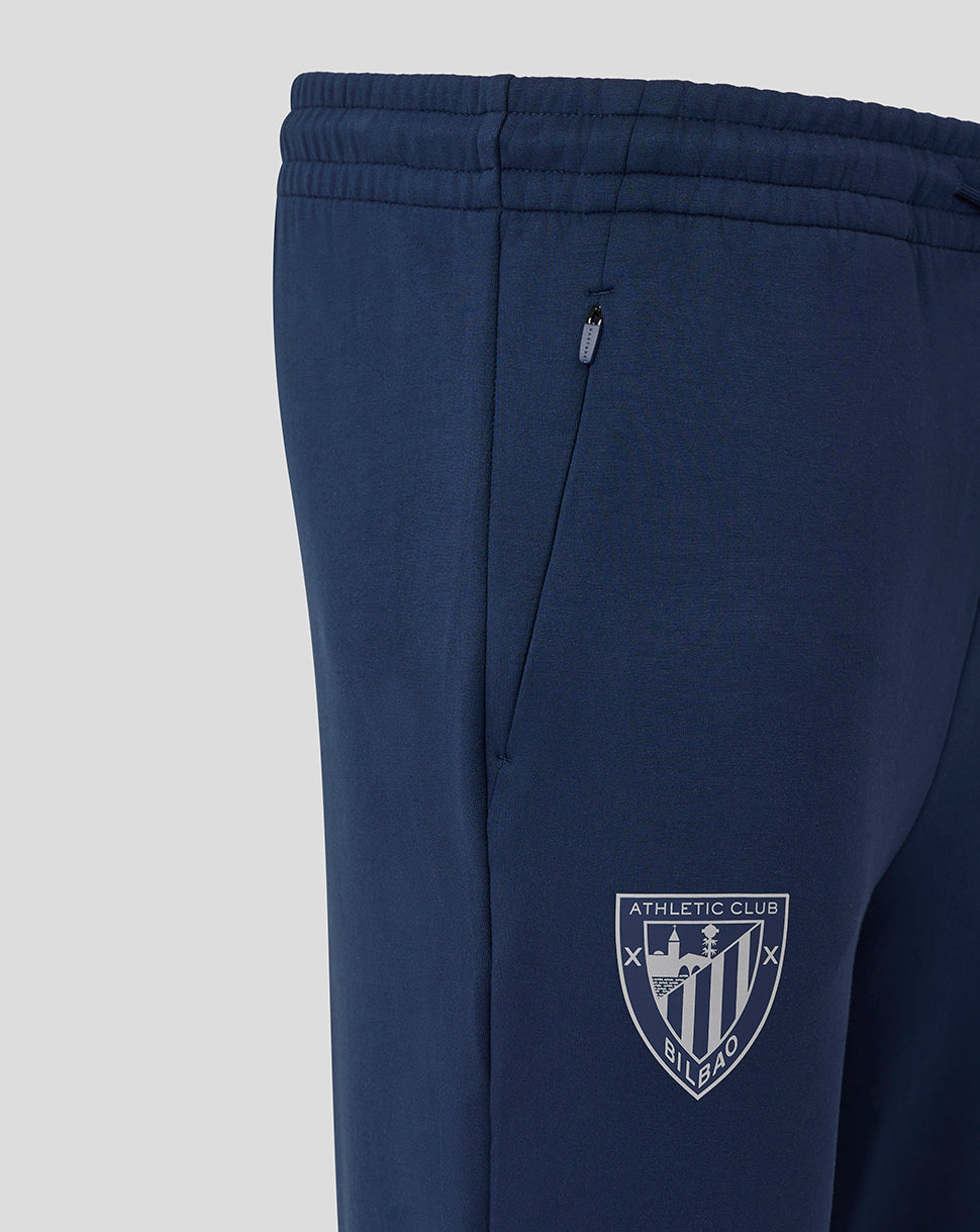 Navy Athletic Club men's travel knit pants with a zip pocket and club crest.