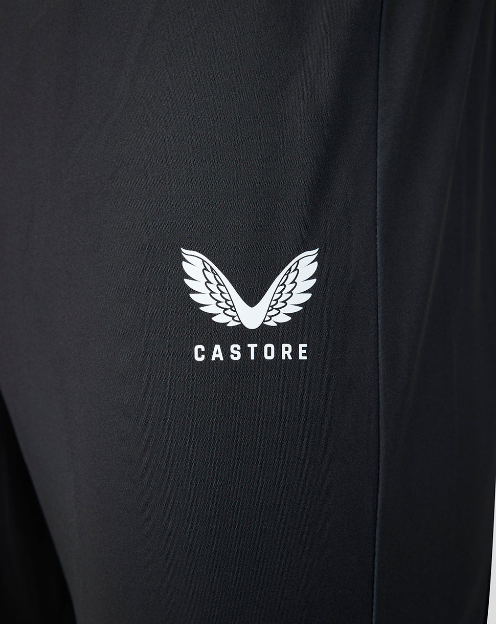 Close up of black Castore pant fabric with white wing logo