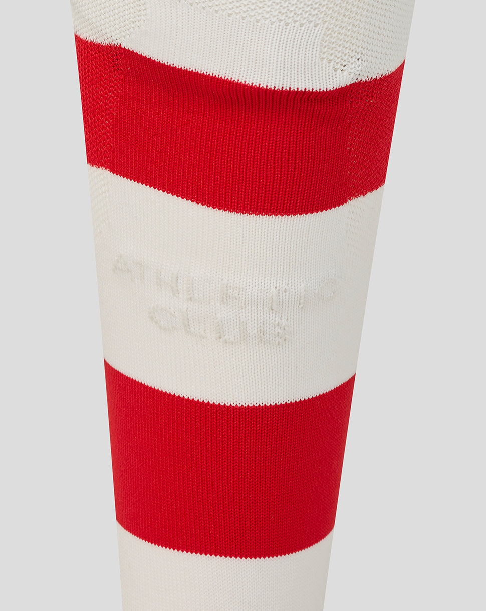 Close up of a white red striped Athletic Club Junior retro sock featuring bold red bands and embossed branding