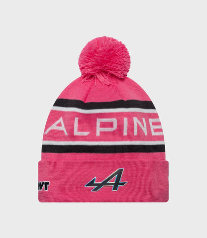 Pink knit beanie with pom pom and Alpine logo on the cuff