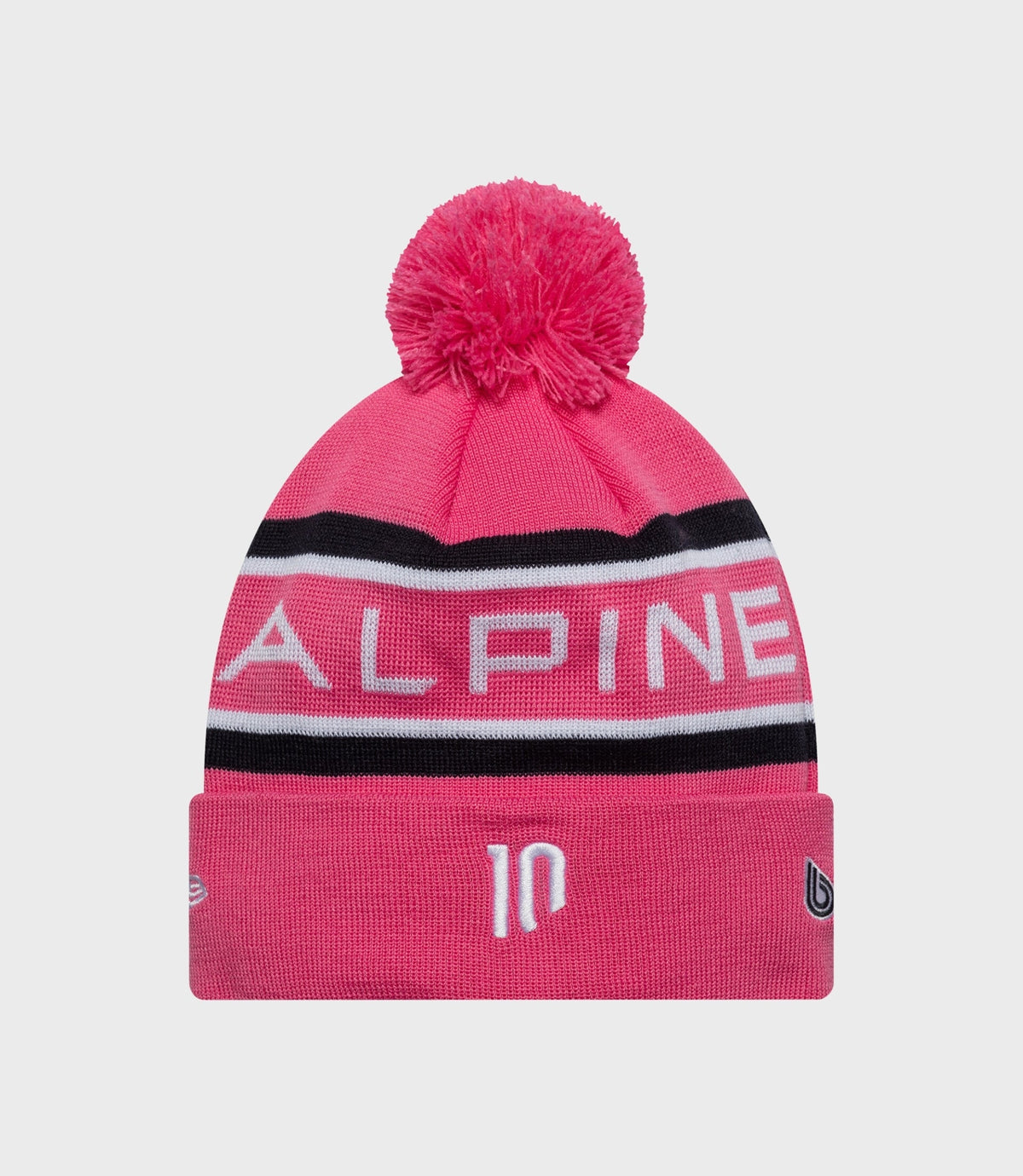 Pink knit beanie with fluffy pom pom and Alpine branding on the cuff