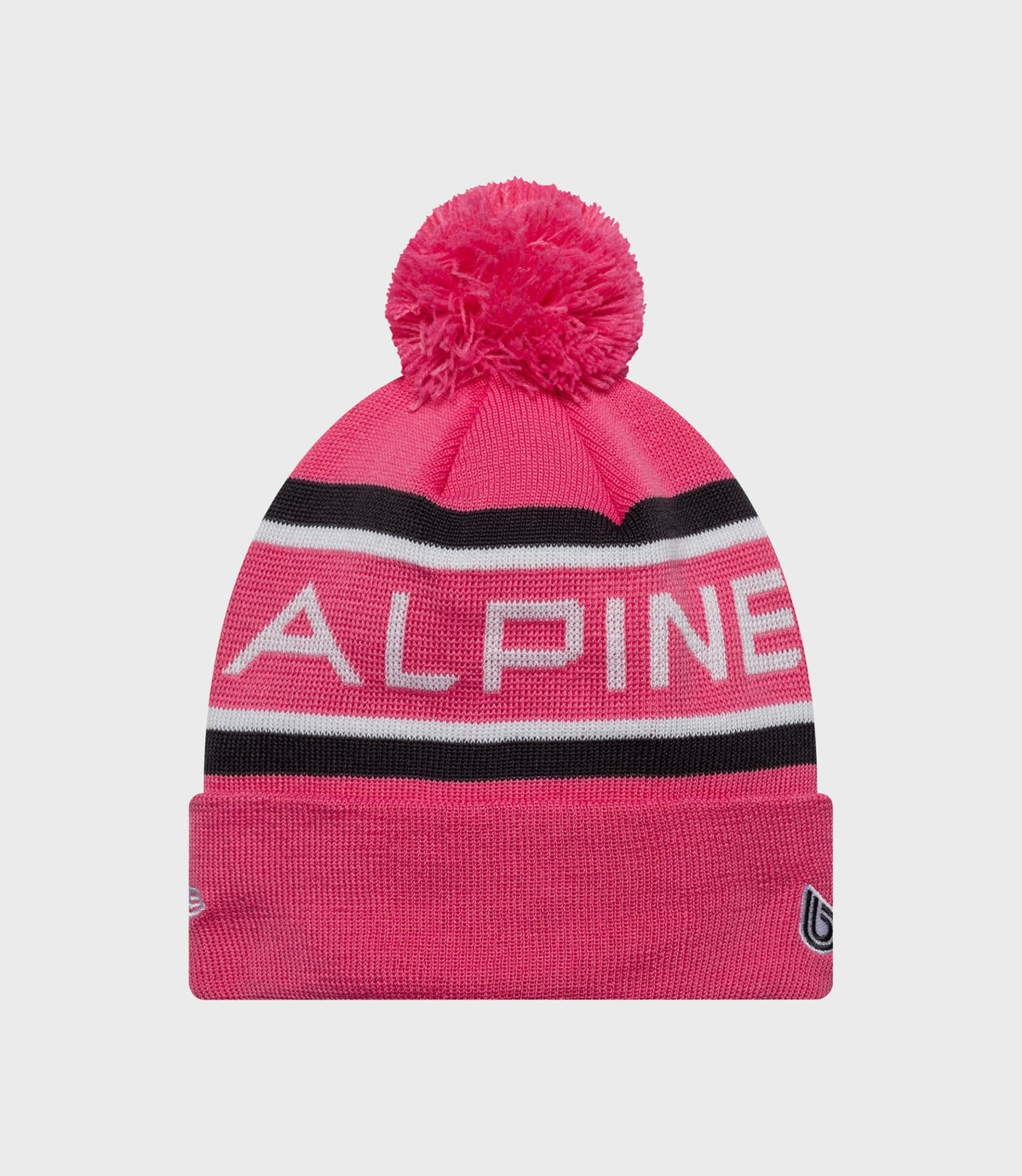 Pink knit junior beanie with pom pom and Alpine lettering on the cuff
