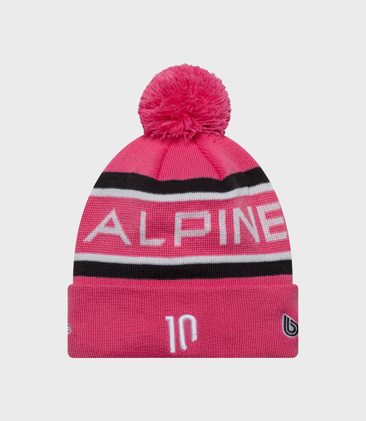 Pink knit beanie with a fluffy pom pom and Alpine branding on the cuff