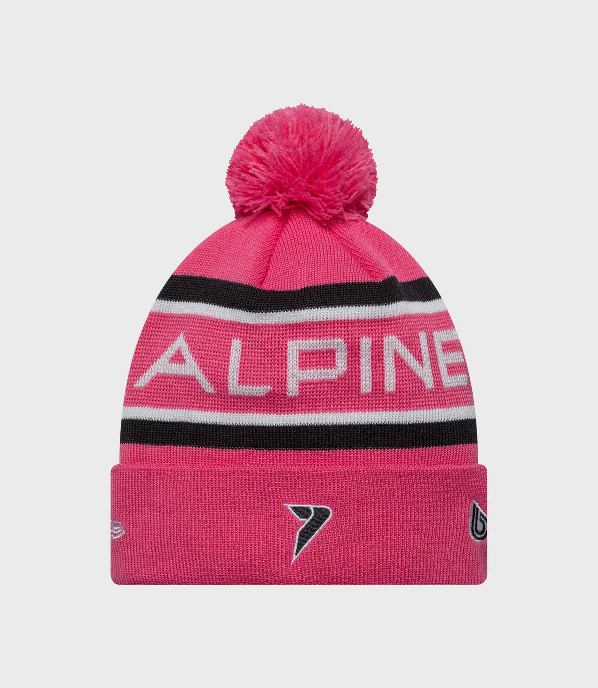 Bright pink knit hat with pom pom and bold Alpine branding across the front