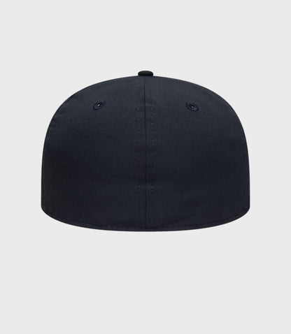 Side view of navy cap with pink BWT embroidery on the back panel and pink-trimmed brim.