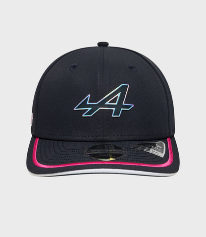 Front view of navy 9Seventy Stretch Snap Junior cap with a holographic emblem on the crown