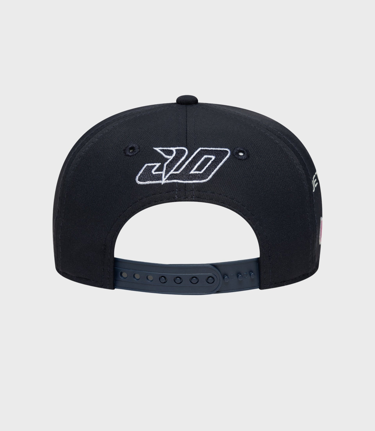 Back view of navy cap showing embroidered logo on the crown and adjustable strap