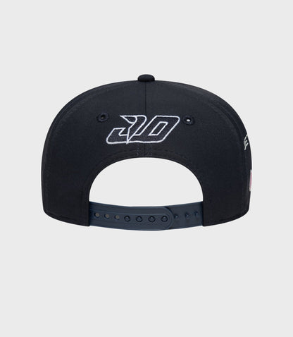 Back view of navy cap showing embroidered logo on the crown and adjustable strap