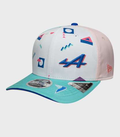 Close up of New Era Miami 9Seventy Stretch Snap cap with white crown and colorful geometric print, pink side panel and blue top button.