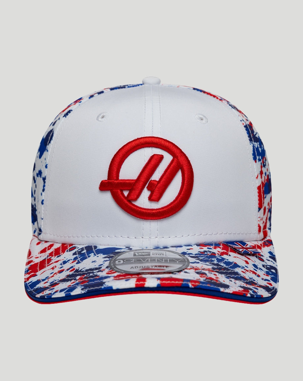 White cap with red logo and blue and red patterned brim on a white background