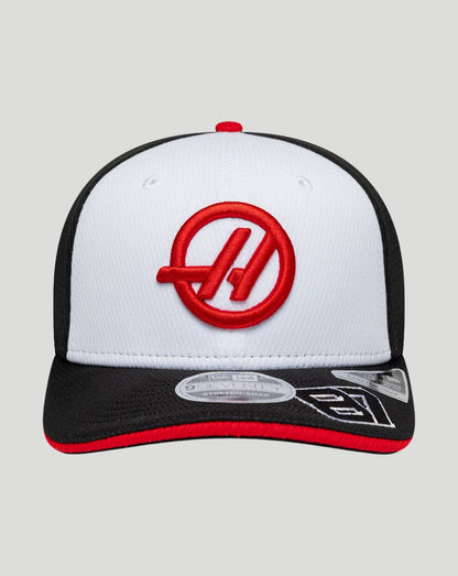 White and black cap with a red logo on a light gray background
