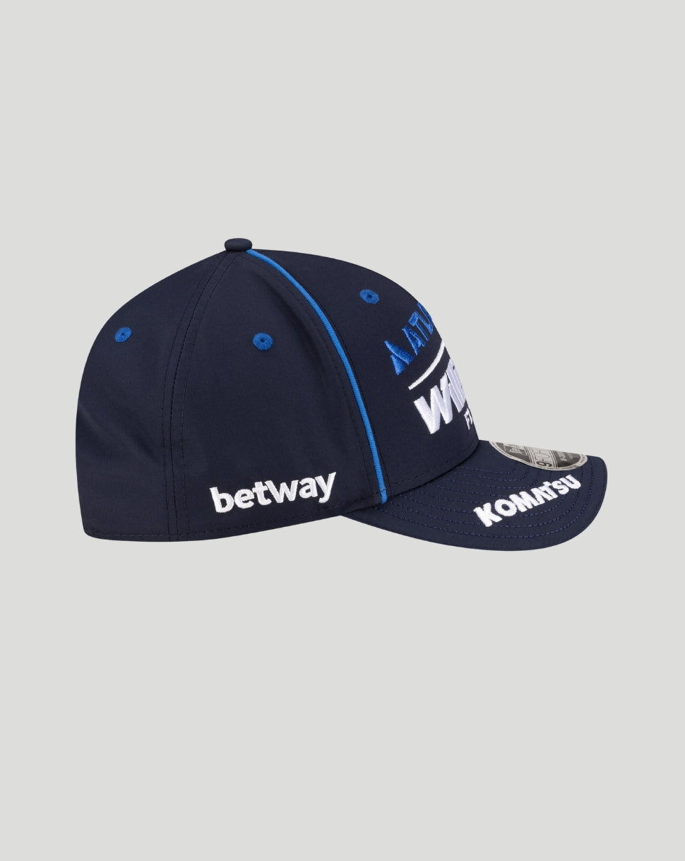 Angled navy Williams Racing cap showing Atlassian front logo Komatsu on the visor and betway on the side