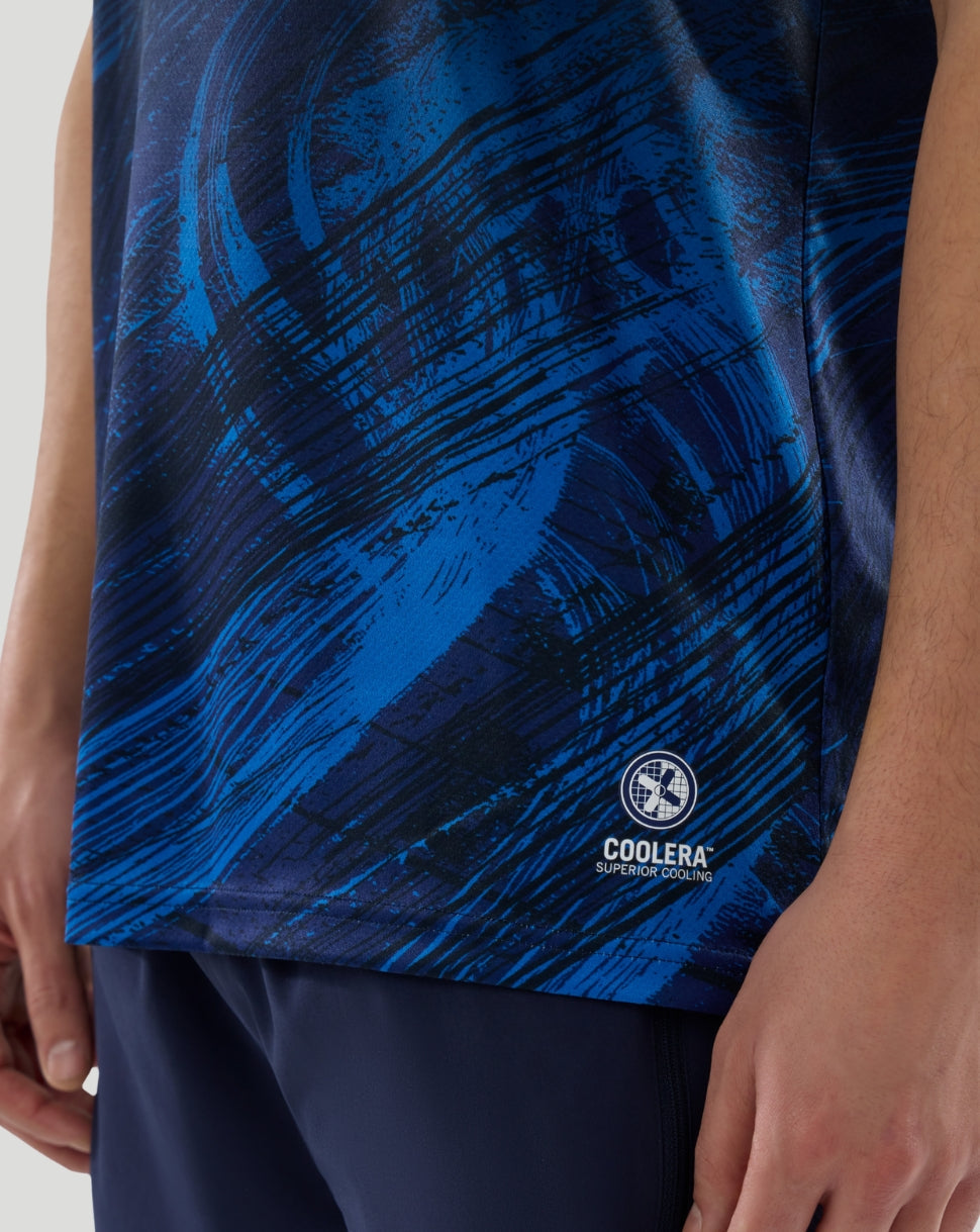 Close up of navy Williams Racing T Shirt fabric with blue abstract pattern and Coolera cooling logo at the hem