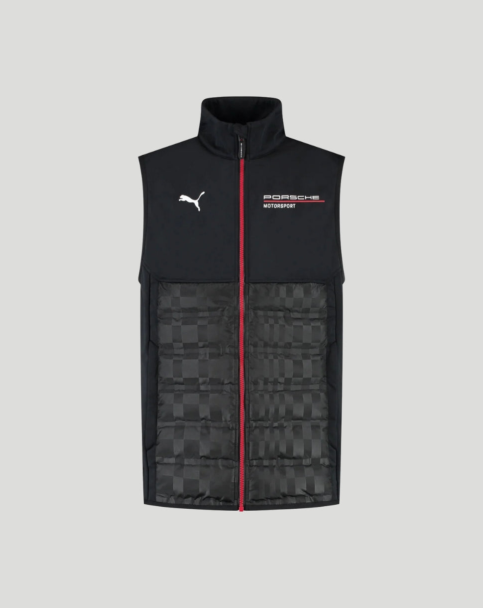 A black sleeveless zip-up vest with a high collar, featuring a black and gray checkered pattern on the lower half, a red center zipper, and white Puma and Porsche logos on the chest, shown against a solid gray background.