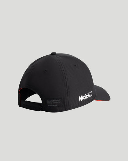A black Mobil 1 baseball cap shown from a three-quarters back view, featuring a white Mobil 1 logo on the brim and a small red accent line along the edge of the brim, set against a solid light gray background.