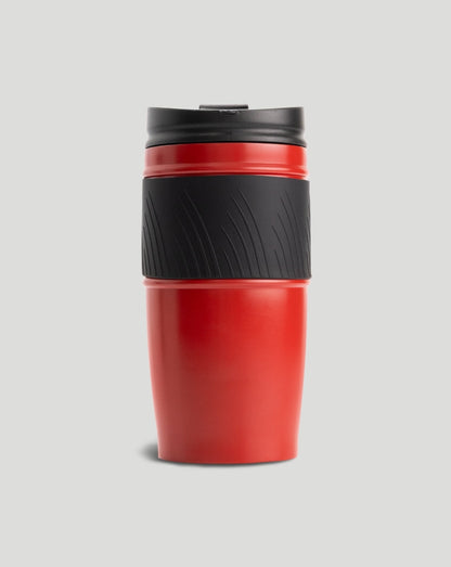 Red Scuderia Ferrari thermal mug with black grip and shield emblem against a light grey background