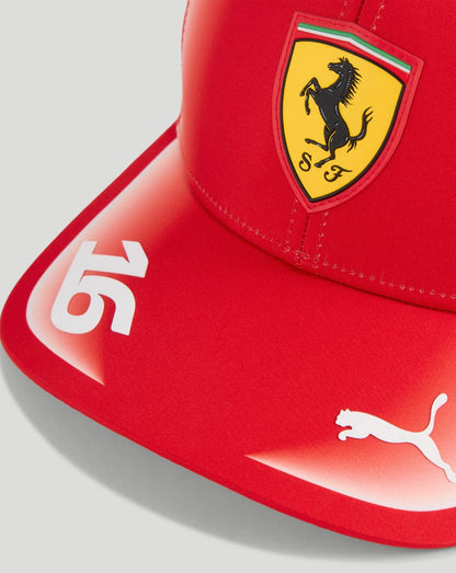 Red Scuderia Ferrari youth cap with yellow shield logo and white 65 graphic on the curved brim