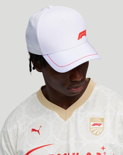 Unisex white F1 fanwear baseball cap with red logo on the front.