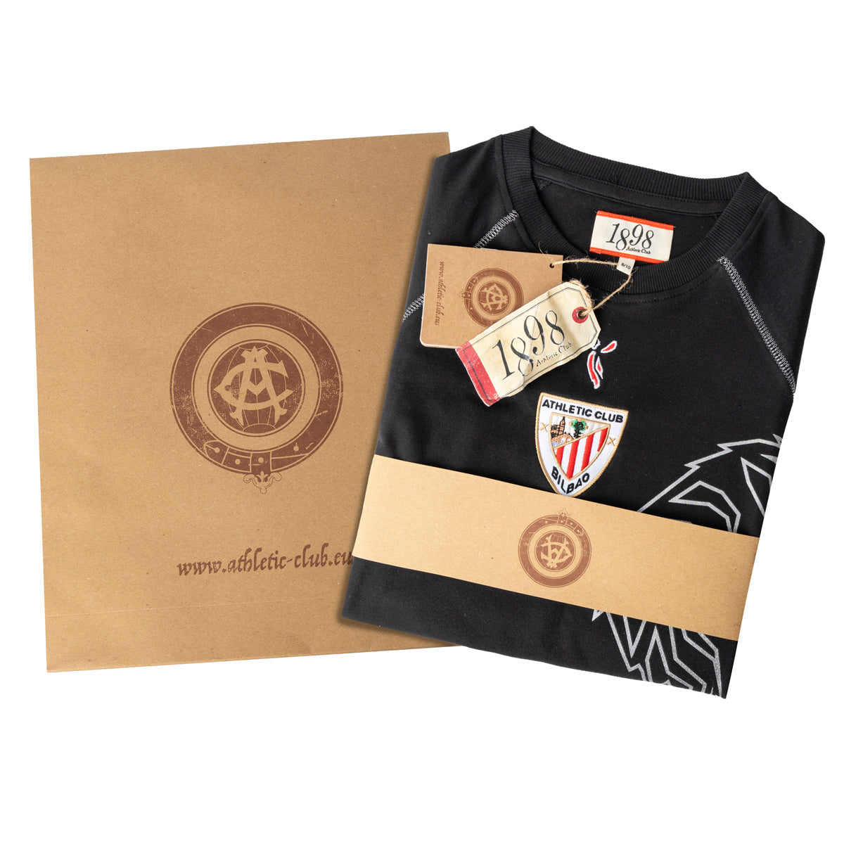 Folded black junior retro lion shirt with tags and brown packaging box