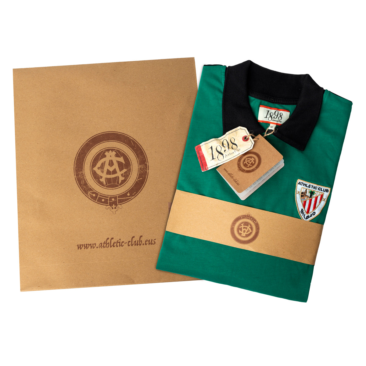 Folded green junior retro goalkeeper shirt with black collar and crest, shown with tags and packaging.