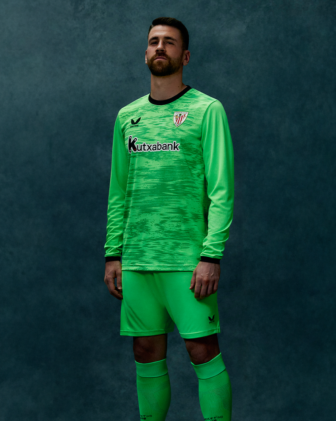 Athletic Club away goalkeeper long sleeve jersey in bright green with black collar and Kutxabank sponsor.