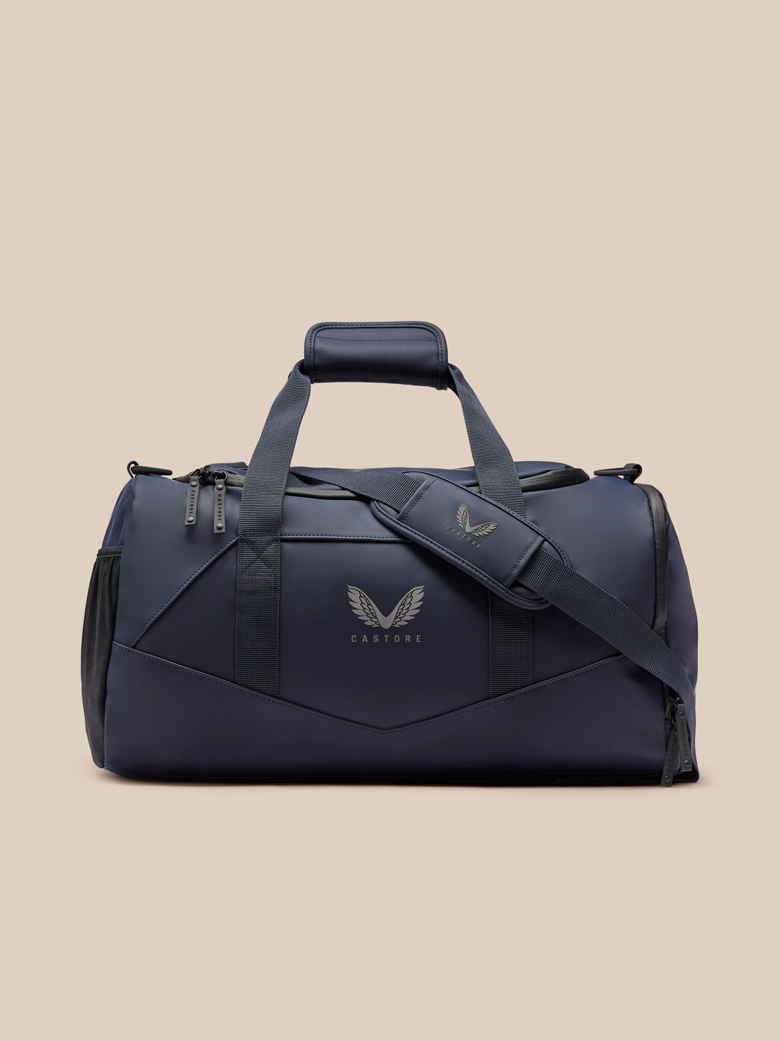 Navy Core Holdall featuring padded top handle and detachable shoulder strap with Castore wing logo.