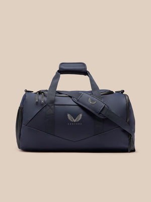 Navy Core Holdall featuring padded top handle and detachable shoulder strap with Castore wing logo.