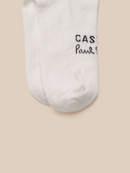 White socks with text on a beige background