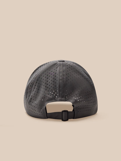 Grey cap with a beige patch on a beige background