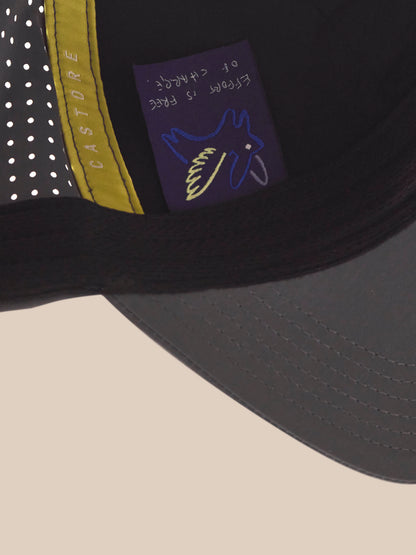 Close-up of a cap with a logo and text on a beige background