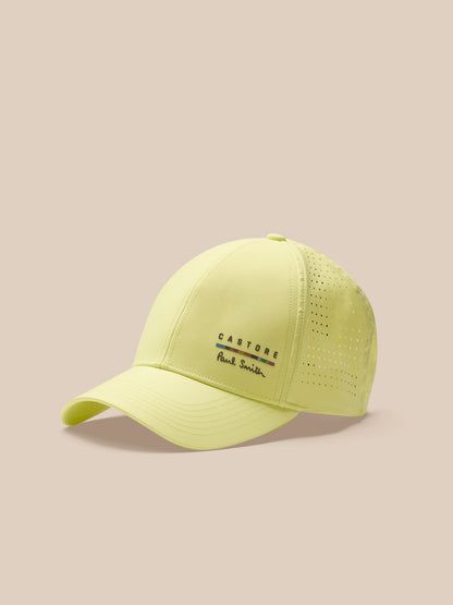 Yellow cap with brand logo on a beige background