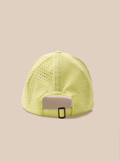 Yellow cap with a gray patch on a beige background