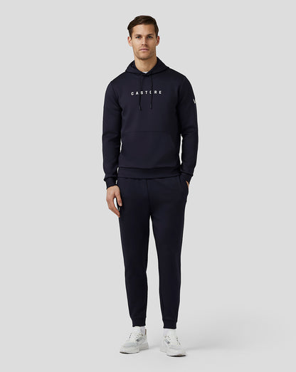 Male model wearing navy Flex Hoodie with an oversized front pocket and CASTORE logo on the chest.