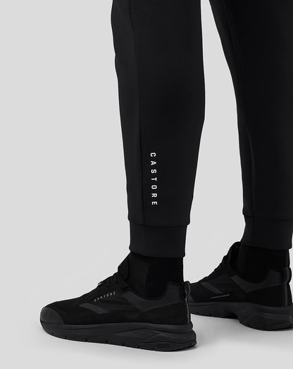 Close-up of lower leg area on black Flex Joggers with vertical CASTORE branding and cuffed ankles