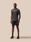 Male model wearing Flow Training Shorts in black with elastic waistband and side pockets; Castore branding on the thigh