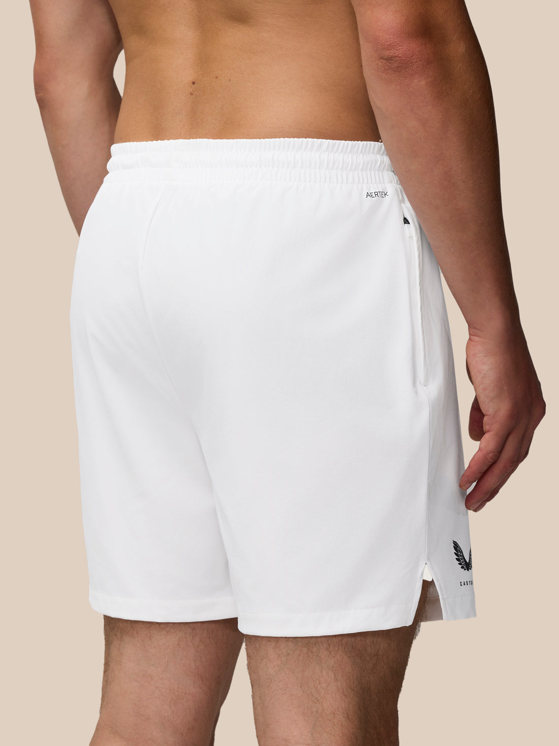 White Adapt Training shorts back view with elastic waistband and AERTEK branding near the right hip.