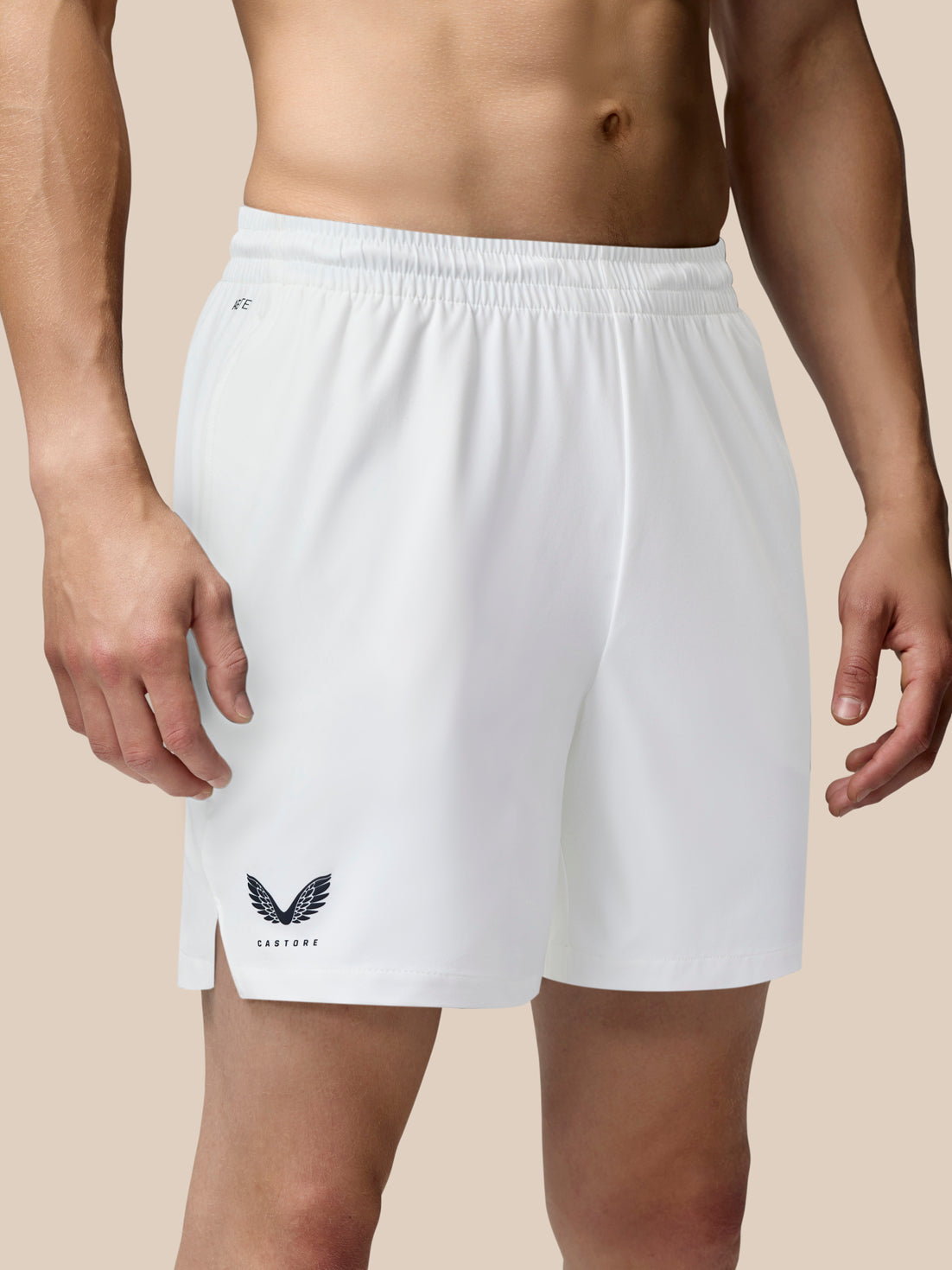 White Adapt Training shorts with 6 inch length featuring a Castore logo on the right thigh and secure elastic waistband.