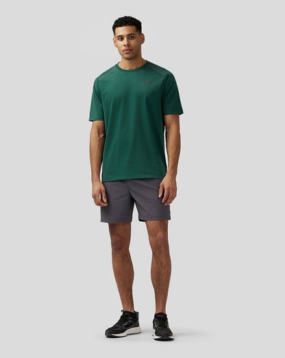 Model wearing green Apex Aeromesh T-Shirt with dark shorts front view showing crew neck and relaxed fit