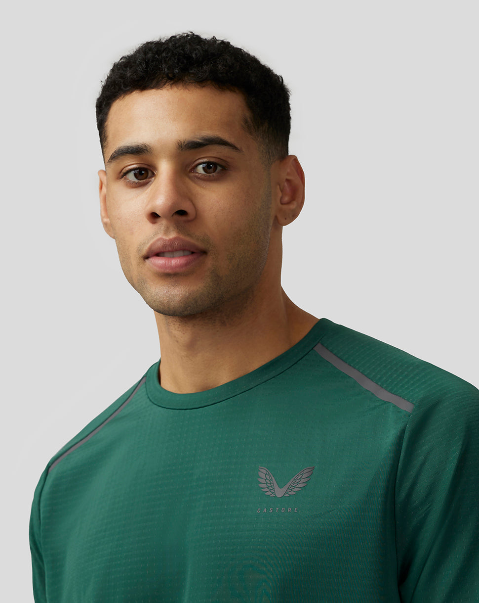 Close-up of green Apex Aeromesh T-Shirt front highlighting chest Castore logo and shoulder seams