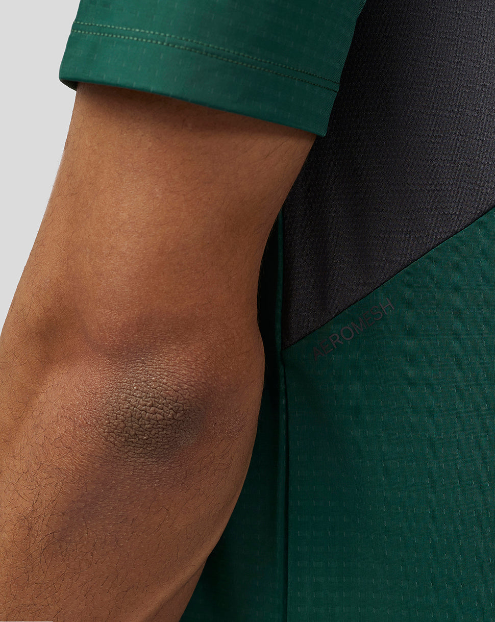 Close up of green Apex Aeromesh T Shirt sleeve showing Aeromesh back panel and reflective branding