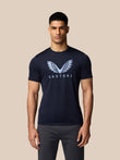 Male model in navy graphic training T shirt with Castore wings logo on chest.
