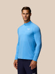 Male model wearing Cool Blue Adapt Training 1/4 Zip Top with long sleeves and zip front.