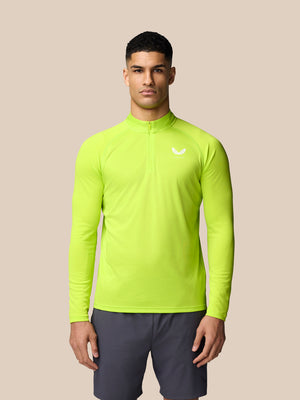 Male model in Acid Lime Adapt Training 1/4 Zip Top with front quarter zip and left chest logo.