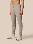 Front view of a model wearing Rock Grey Flex Lifestyle Joggers with drawstring waist cuffed ankles and waterproof zip pockets